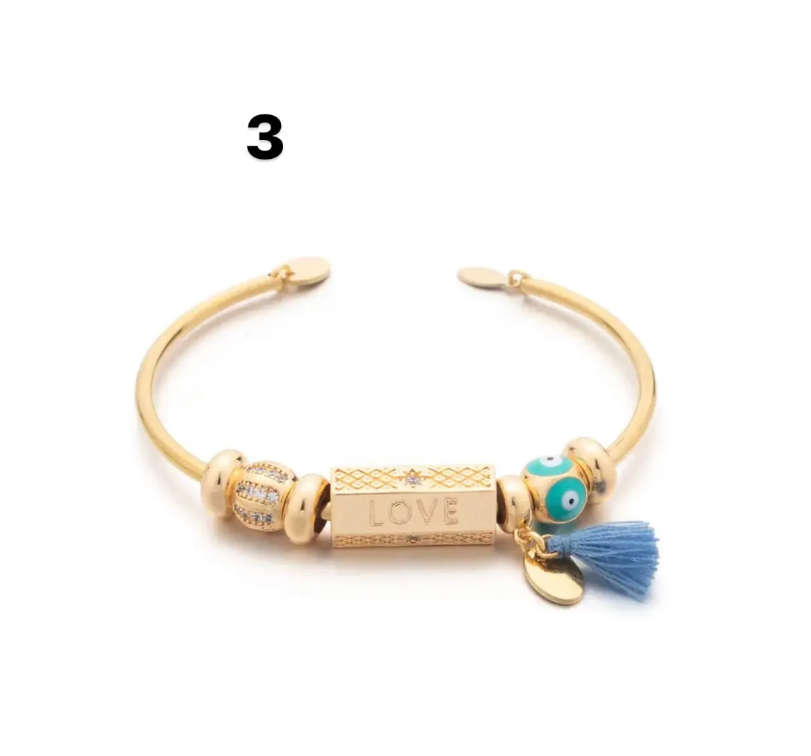 Bracciale bangle amuleto turco cilindrico e charms vari colori